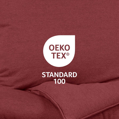 OEKO-TEX Standard 100 logo on a maroon fabric background