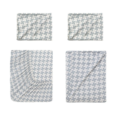 Four folded sheets with a light blue and white geometric star pattern arranged in a 2x2 grid on a white background.