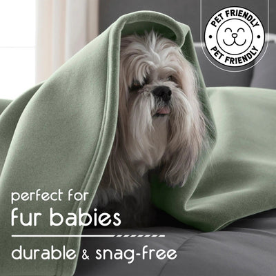 Dog wrapped in a green blanket with 'Pet Friendly' logo and text about durability and snag-free quality.