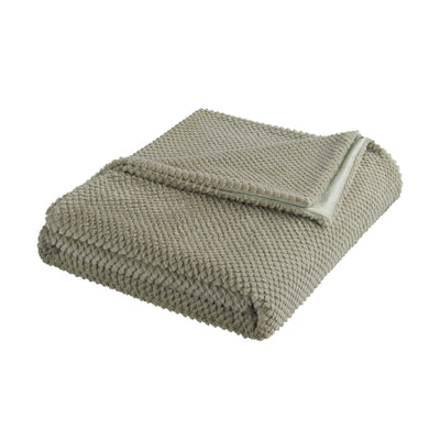 Folded green blanket on a white background