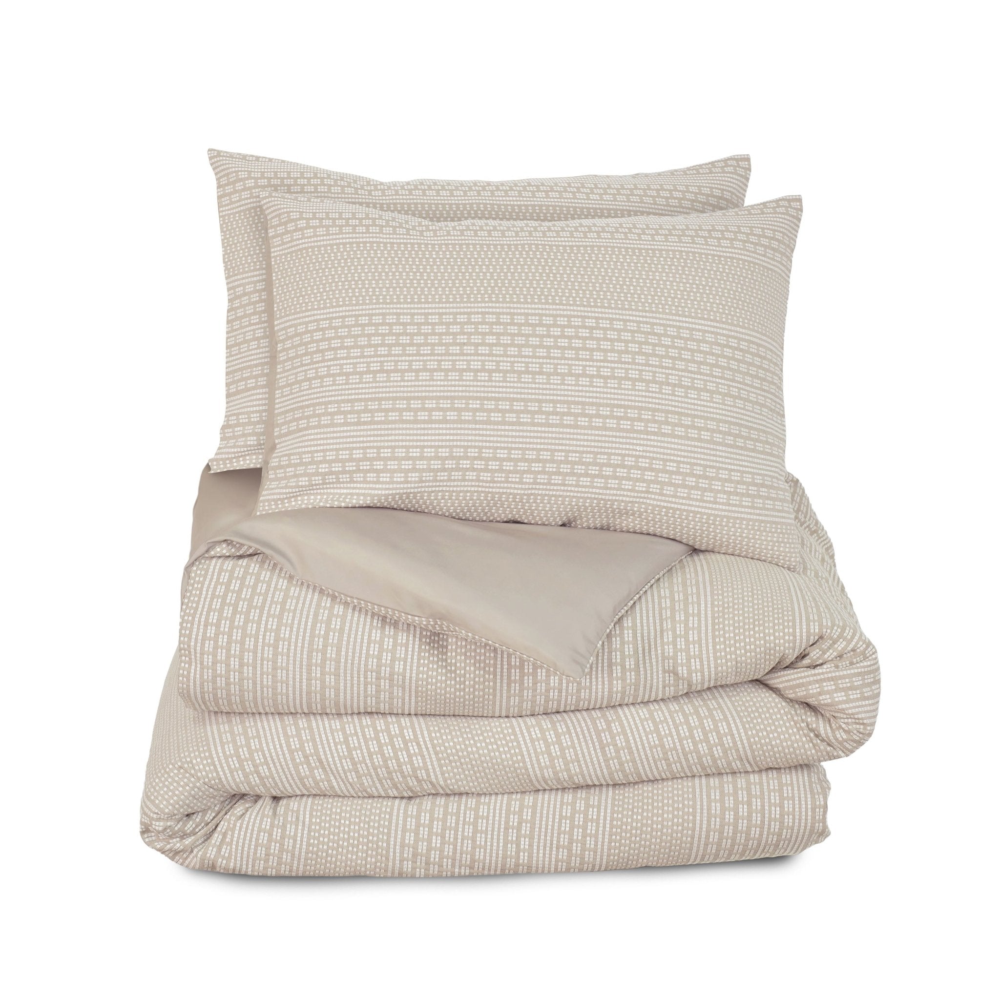 Beige textured comforter set on a white background