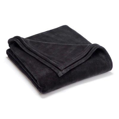 Folded charcoal blanket on a white background