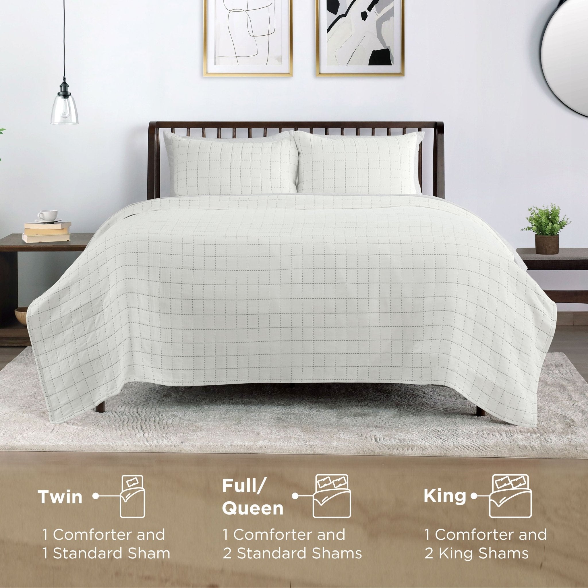 Bed with ivory coverlet and pillow shams in a bedroom setting, showing size information.