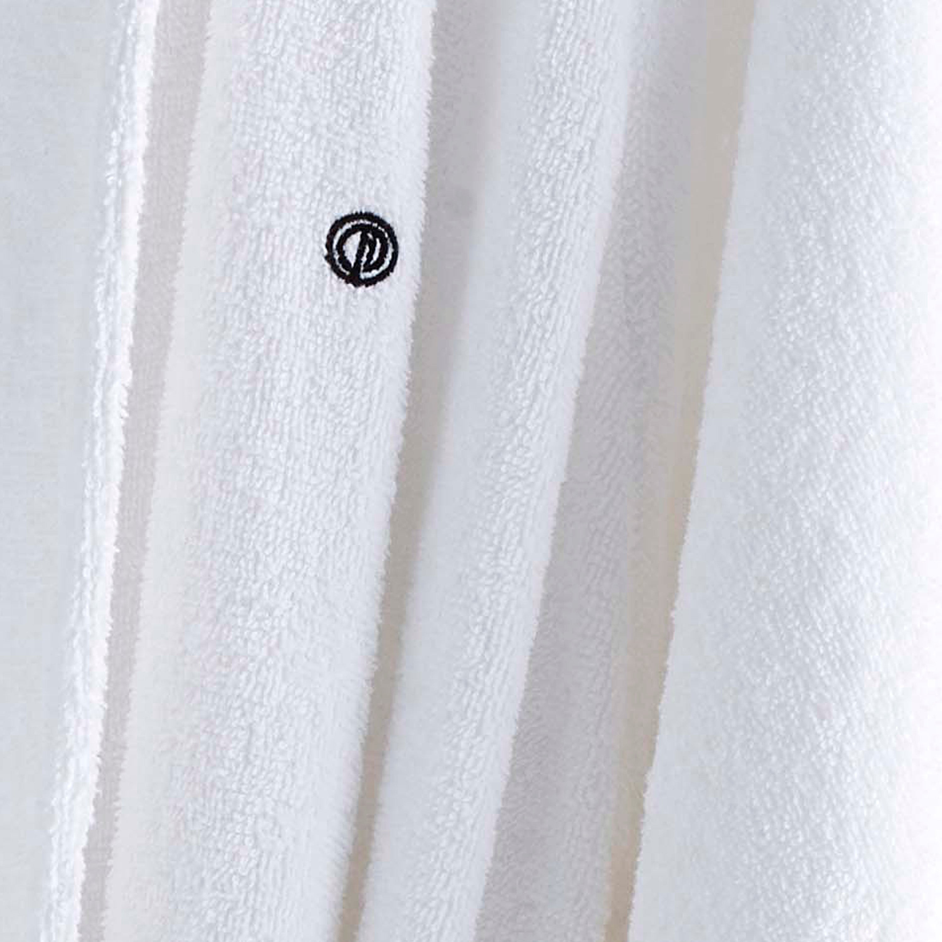 White terry bath robe with low lint texture and a small embroidered logo.