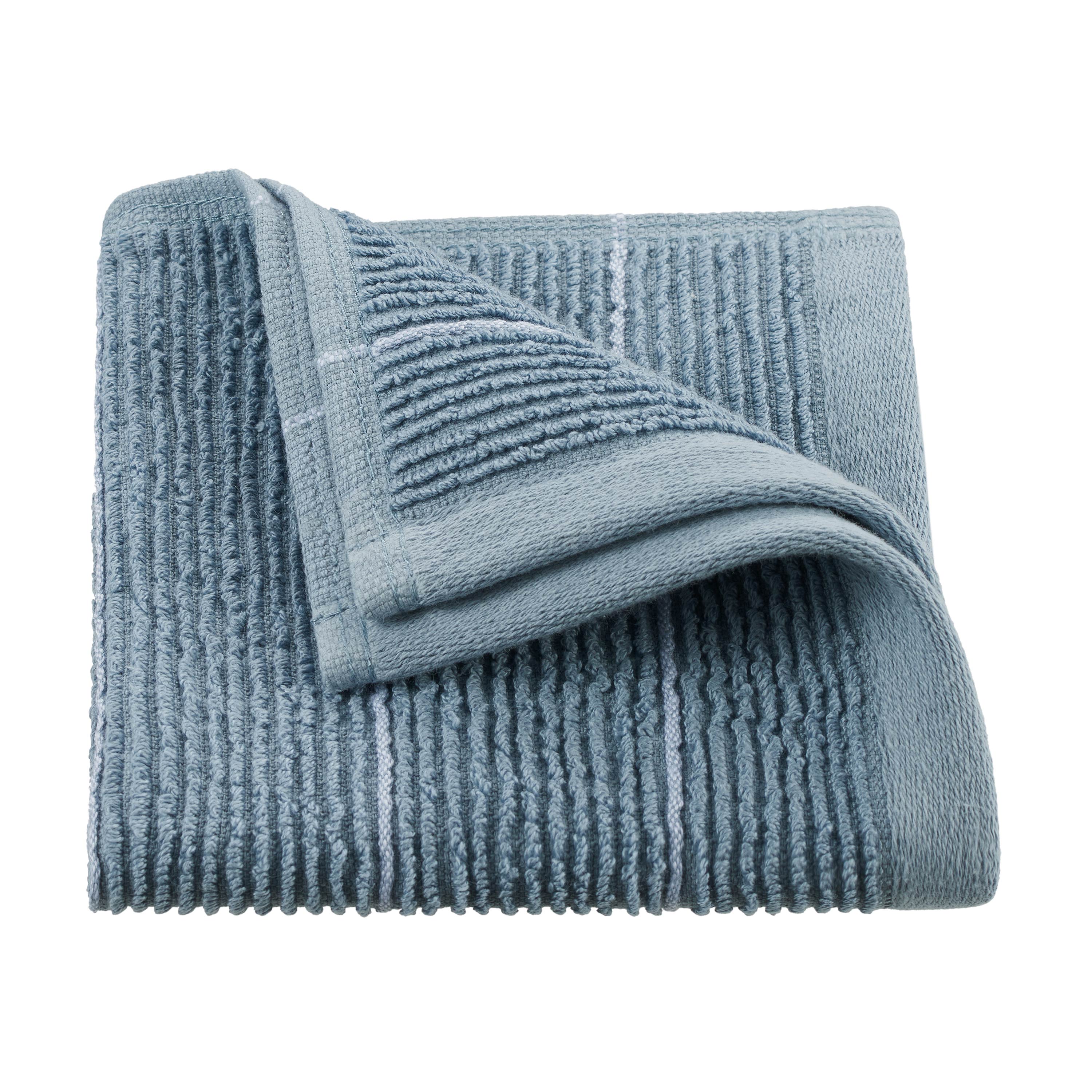 Soft blue towel with textured stripes, folded with one corner partially turned down.