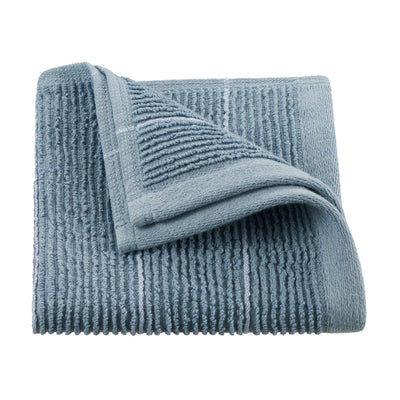Soft blue towel with textured stripes, folded with one corner partially turned down.