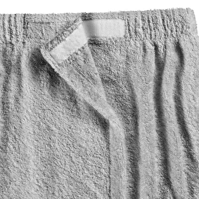 Gray terry cloth shower wrap with a velcro closure and elastic waistband.