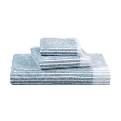 Four towels in varying sizes, featuring a sculpted stripe design in light blue and white.