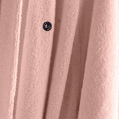 Light pink terry bath robe with low lint texture and a small embroidered logo.
