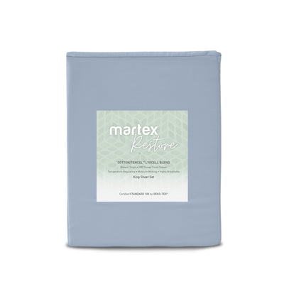 Solid blue king sheet set with a label detailing fabric blend and features.