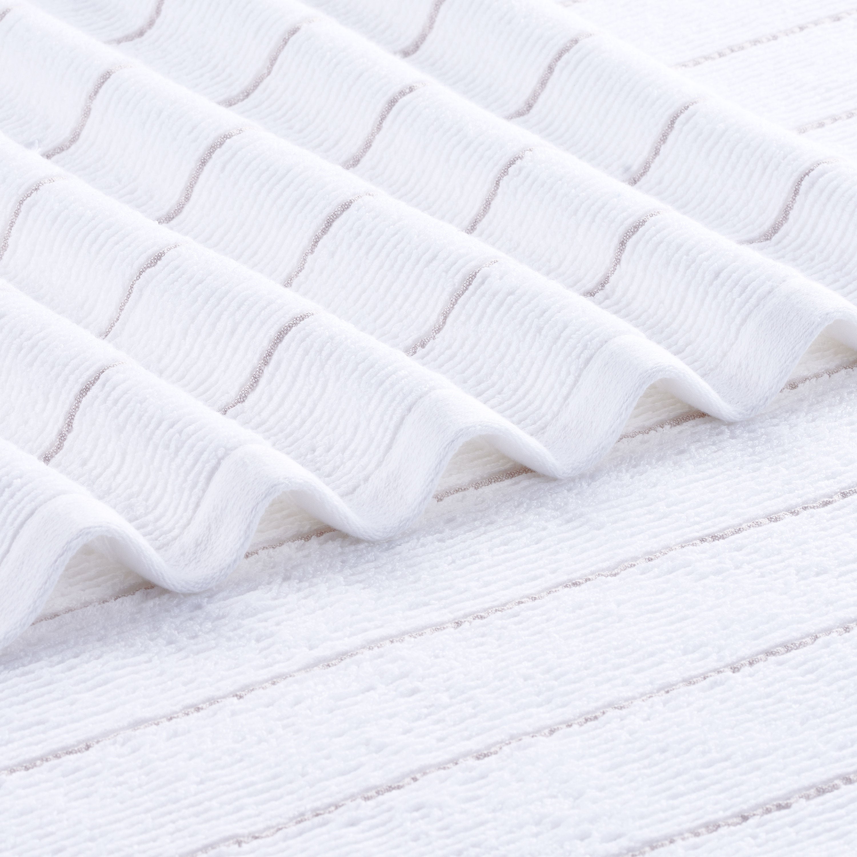 White towel with slub stripe texture and subtle horizontal lines.