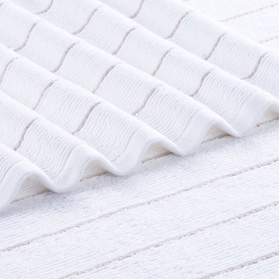 White towel with slub stripe texture and subtle horizontal lines.