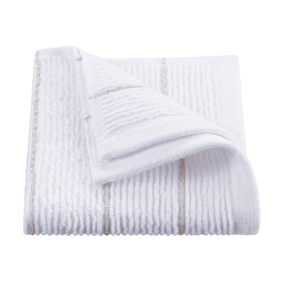 White towel with textured slub stripes and a folded corner revealing a subtle decorative stripe.