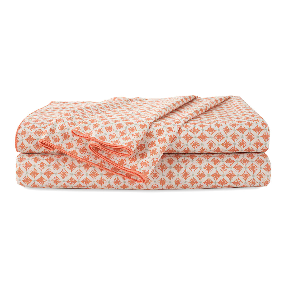 Folded sheet set featuring a geometric pattern in orange and white.