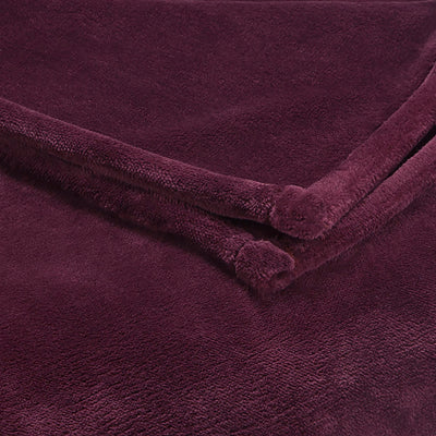 Deep purple sheared faux mink blanket with soft texture and rolled edges.