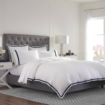 White Duvet set on a bed in a modern bedroom.