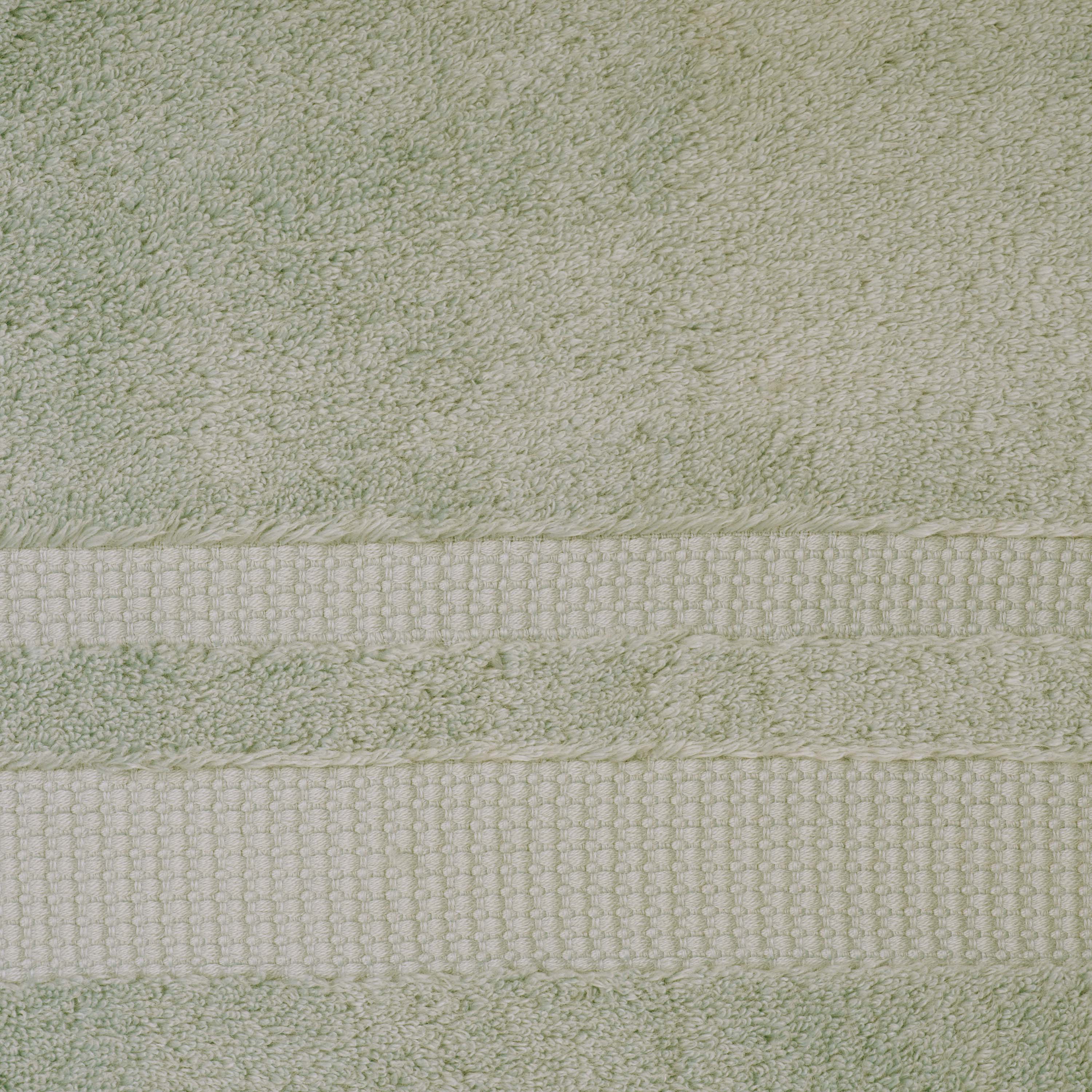 Light green towel with textured stripes and a soft, plush surface.